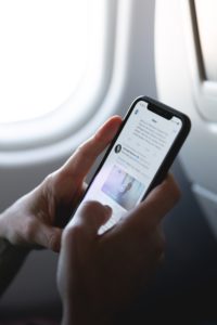 Photo of someone tweeting on a plane